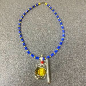 Hand made blue and gold softball necklace